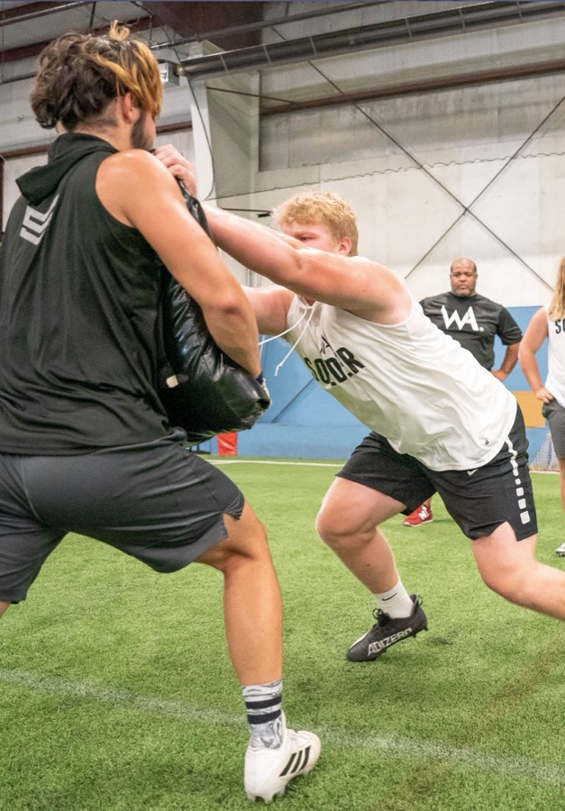 Warren Academy athletes training with coaching staff